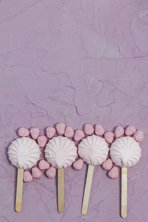 Marshmallows on pink background. Colorful marshmallow sweets with copy space. View from above or top viewの写真素材