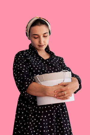 Portrait of young middle-eastern woman with gift box. Romantic giftbox. Boxing day, holiday,...