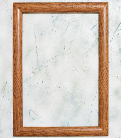 Empty wooden picture frame on the bright background. Copy space for textの写真素材