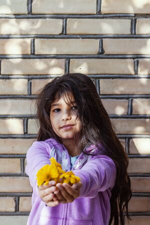 Portrait of a beautiful teen girl at outdoors. A little girl having fun during summer vacations. Face expression, Feeling happy, Fun, Playful and Joyful teen. Happy childhoodの写真素材