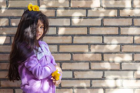 Portrait of a beautiful teen girl at outdoors. A little girl having fun during summer vacations. Face expression, Feeling happy, Fun, Playful and Joyful teen. Happy childhoodの写真素材