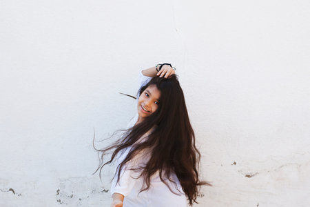 Portrait of a beautiful teen girl at outdoors. A little girl having fun during summer vacations. Face expression, Feeling happy, Fun, Playful and Joyful teen. Happy childhoodの写真素材