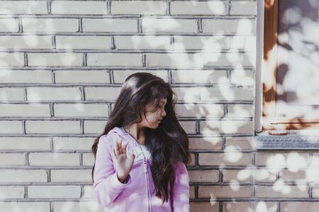 Portrait of a beautiful teen girl at outdoors. A little girl having fun during summer vacations. Face expression, Feeling happy, Fun, Playful and Joyful teen. Happy childhoodの写真素材