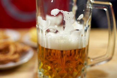 A glass of crafty beer. International beer day or Octoberfest concepts. Drinking beer after a hard...