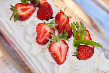 Freshly baked sweet strawberry Long-Cake Roll, also called Strawberry roulade