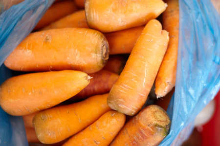 Pile of fresh organic carrots. Healthy eating. Purchasing fresh vegetables in the marketの写真素材