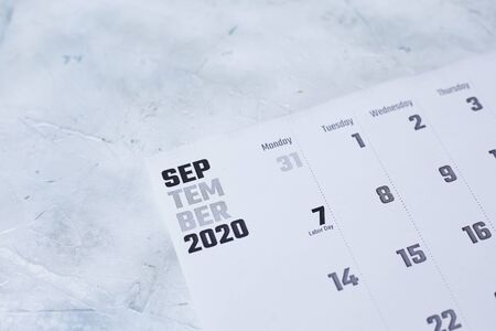 Simple 2020 September monthly calendar on table with office suppliesの写真素材