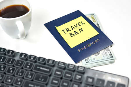 A passport and sticker with words - Summer holidays cancelled. Effect of COVID-19 and coronavirus on travel industry. Flights cancellations due to pandemicの写真素材