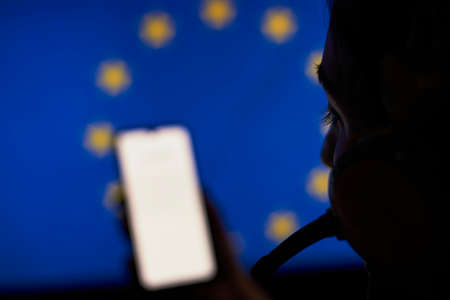 Secret Service officer recording European union politics conversations with special listening deviceの写真素材