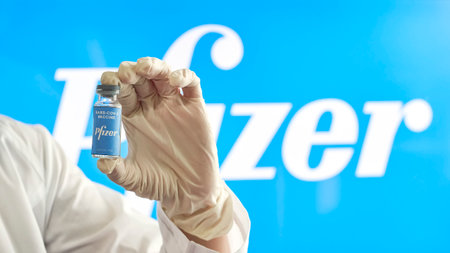 Tashkent, Uzbekistan - December 7, 2020: A doctor holds a new vaccine against Covid-19 from American pharmaceutical company Pfizerのeditorial素材