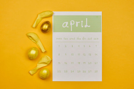 Decorated easter eggs with April calendar. Bright April monthly calendar and golden colored Easter...