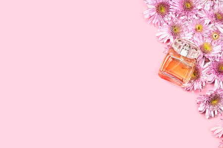 Fresh spring flowers and perfume. Pink background for advertising fragrance for women. Bridal...