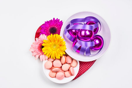 Spring flowers and sweets on white backgroundの写真素材