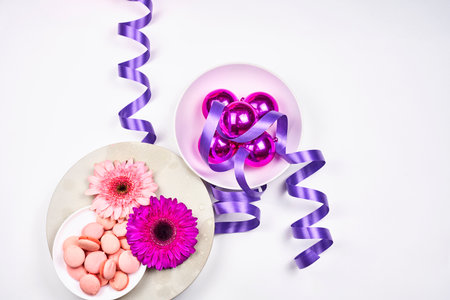 Spring flowers and sweets on white backgroundの写真素材