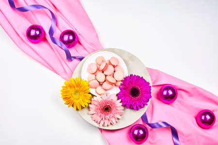 Spring flowers and sweets on white backgroundの写真素材