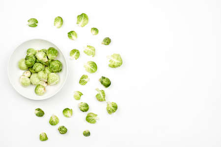 Small cabbages on white, also know as Brussel Sprouts Ki Sabji. Copy spaceの写真素材