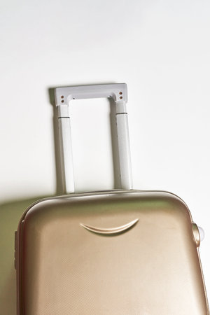Cropped shot of a suitcase over white wallの写真素材