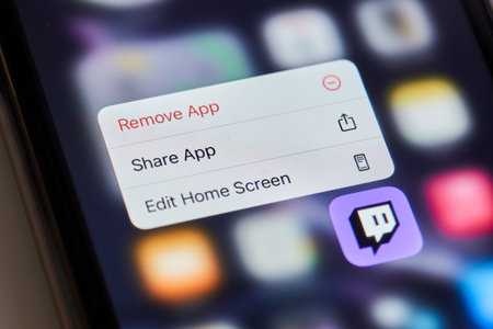 Tashkent, Uzbekistan - July 6, 2021: Uninstalling Twitch application. Deleting popular video...