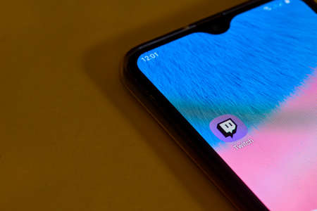 Tashkent, Uzbekistan - July 6, 2021: Twitch icon app on the screen smartphoneのeditorial素材