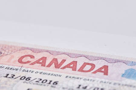 Tashkent, Uzbekistan - 13 August, 2021: Macro shot of Canadian visa. Close-up Canada resident immigration visa in passportのeditorial素材