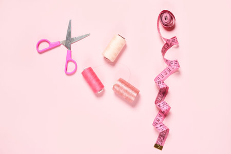 Sewing items from above. Flat lay composition with sewing accessories on light color background....