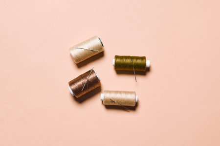 Sewing items flat lays from above. Collection of threads for sewing on bright background