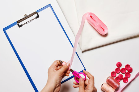 Sewing items from above. Flat lay composition with sewing accessories on light color background....