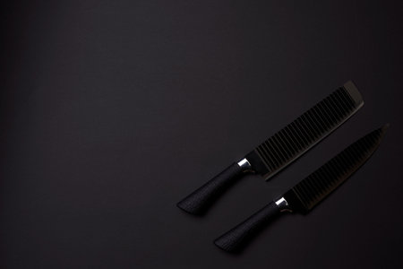 Black friday concept. Set of sharp kitchen knifes. Black knifes on dark background