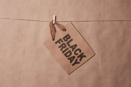 Black friday concept. Craft shopping bags on the ropeの写真素材
