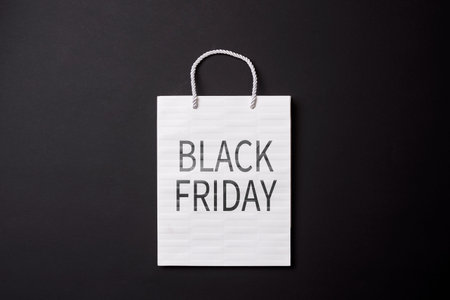 Black friday concept. Shopping bags on black background.