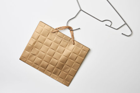 Black friday concept. Shopping bag on cloth holder on white backgroundの写真素材