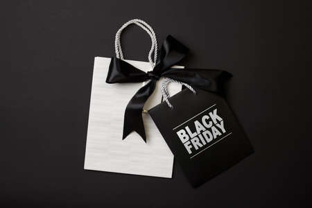 Black friday concept. Pile of various shopping bags on black background.の写真素材