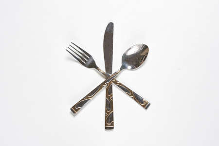 Restaurant eating items - Fork, spoon and knife on white backgroundの写真素材
