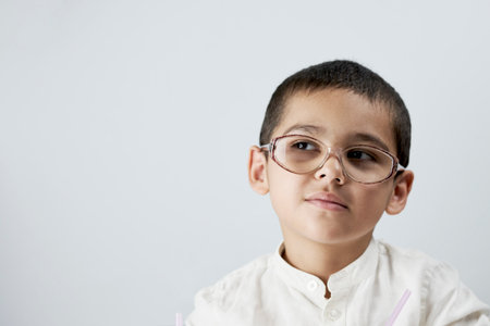 Smart boy in glasses against the white backgroundの素材 [FY310174345184]