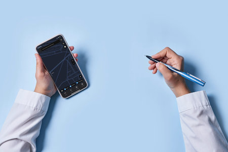 Searching location in with mobile phone digital gps map over blue background