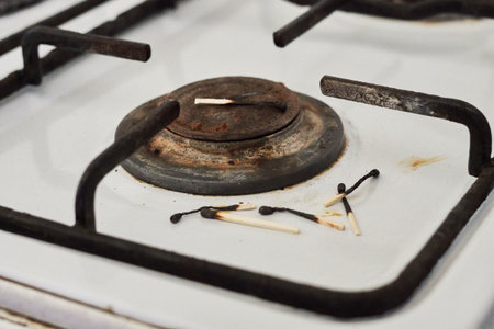 Gas stove and burned matches. Lack of natural gas, no gas, gas shortage problems or tariff bills prices growth conceptsの写真素材