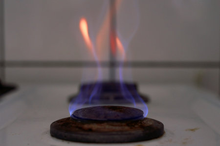 Burning flame on gas stove burner. Burning gas. Hob in the kitchen. Kitchen gas cooker with burning...