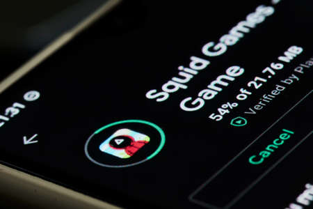 Tashkent, Uzbekistan - 14 October 2021: Popular Netflix new show - Squid games mobile game application. Mobile game of new South Korean series show - Squid gamesのeditorial素材