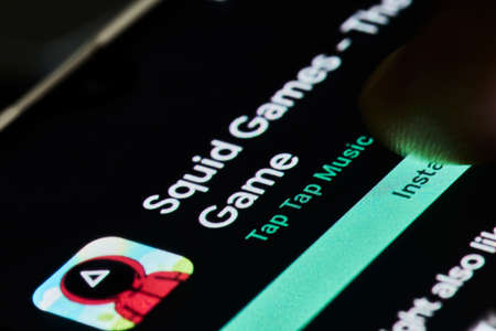 Tashkent, Uzbekistan - 14 October 2021: Popular Netflix new show - Squid games mobile game application. Mobile game of new South Korean series show - Squid gamesのeditorial素材