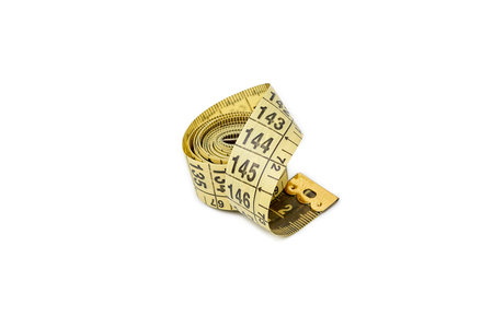 A measuring tape on white background. Yellow measuring tape isolated in white surface