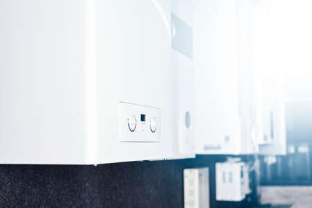 Dual-circuit gas boiler. Gas boiler for home heating. Wall double-bithermic boiler for heating and hot waterの写真素材