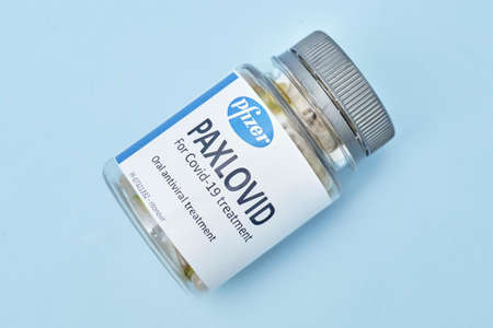 Tashkent, Uzbekistan - November 9, 2021: PF-07321332 or Paxlovid - new antiviral drug developed by Pfizer. Container of Pfizer novel COVID-19 oral antiviral treatment. New coronavirus antiviral pillsのeditorial素材