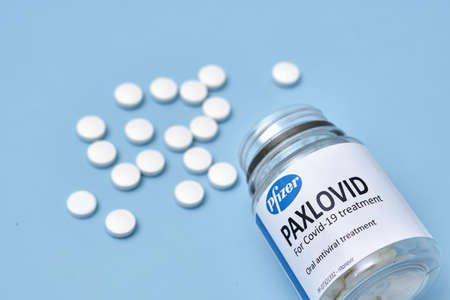 Tashkent, Uzbekistan - November 9, 2021: New Paxlovid Pill For COVID. Oral antiviral Paxlovid pills reduces COVID-19 risks. Pfizers paxlovid lowers COVID hospitalization and deathのeditorial素材
