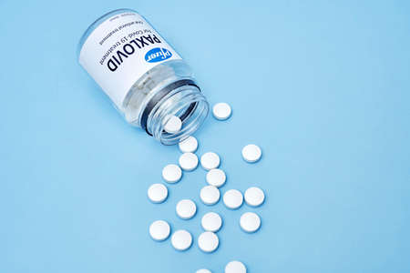 Tashkent, Uzbekistan - November 9, 2021: New Paxlovid Pill For COVID. Oral antiviral Paxlovid pills reduces COVID-19 risks. Pfizers paxlovid lowers COVID hospitalization and deathのeditorial素材