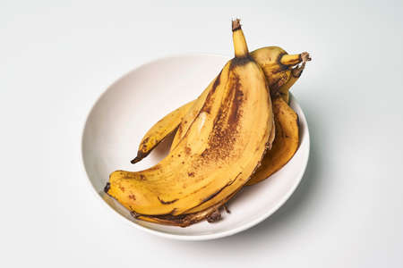 Banana peels or banana skin. Using banana peels in compost, for skin care, hair health and first aid. Health benefits of banana peelの写真素材