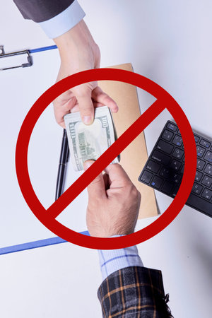 Stop corruption, bribery concepts. Giving money or bribe for signing agreement. Symbol of...