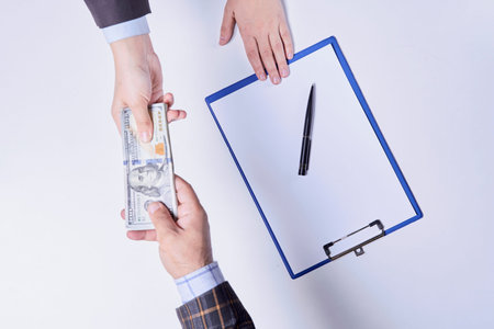 Stop corruption, bribery concepts. Giving money or bribe for signing agreement. Symbol of...