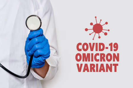 A doctor with stethoscope. Female doctor with a stethoscope in the hands. Doctor using stethoscope in hospitalの写真素材