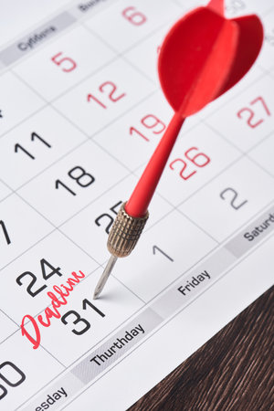 Deadline concept with Dart tip on 31th day of monthly calendar. Deadline concept. 31 day marked on monthly calendar. Last day conceptの写真素材