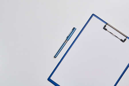 Bright office workspace. Work space with notepad, keyboard, coffee and glasses. Work space table desk. Flat lay, top view, copy spaceの写真素材